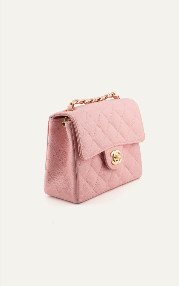 Vintage pink Chanel caviar mini square flap bag side view