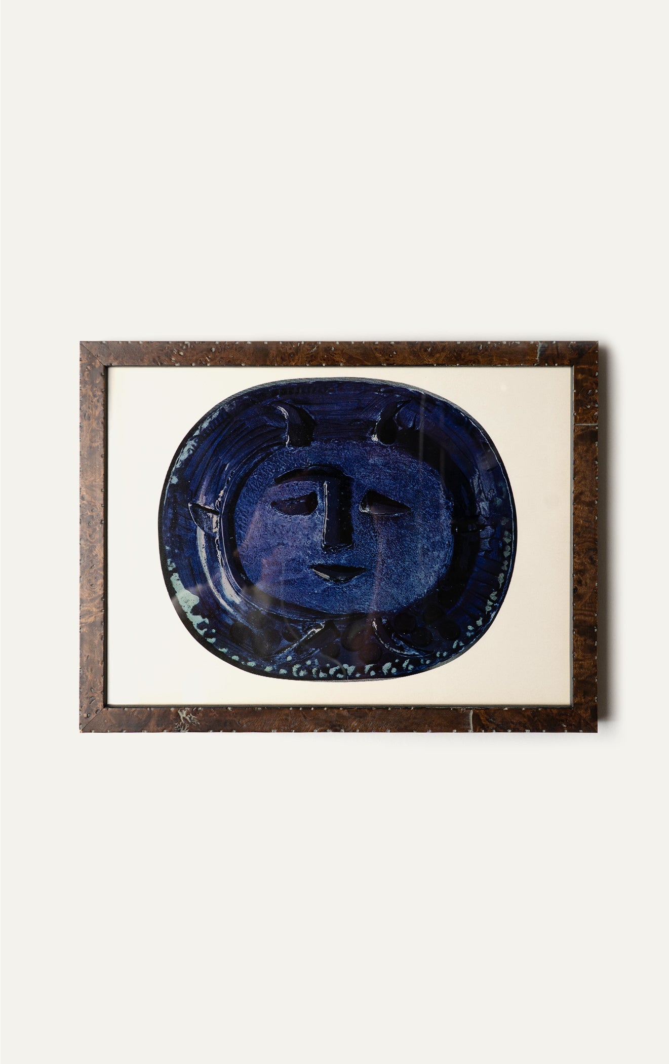 Framed Picasso offset lithograph of a blue face plate in burl frame