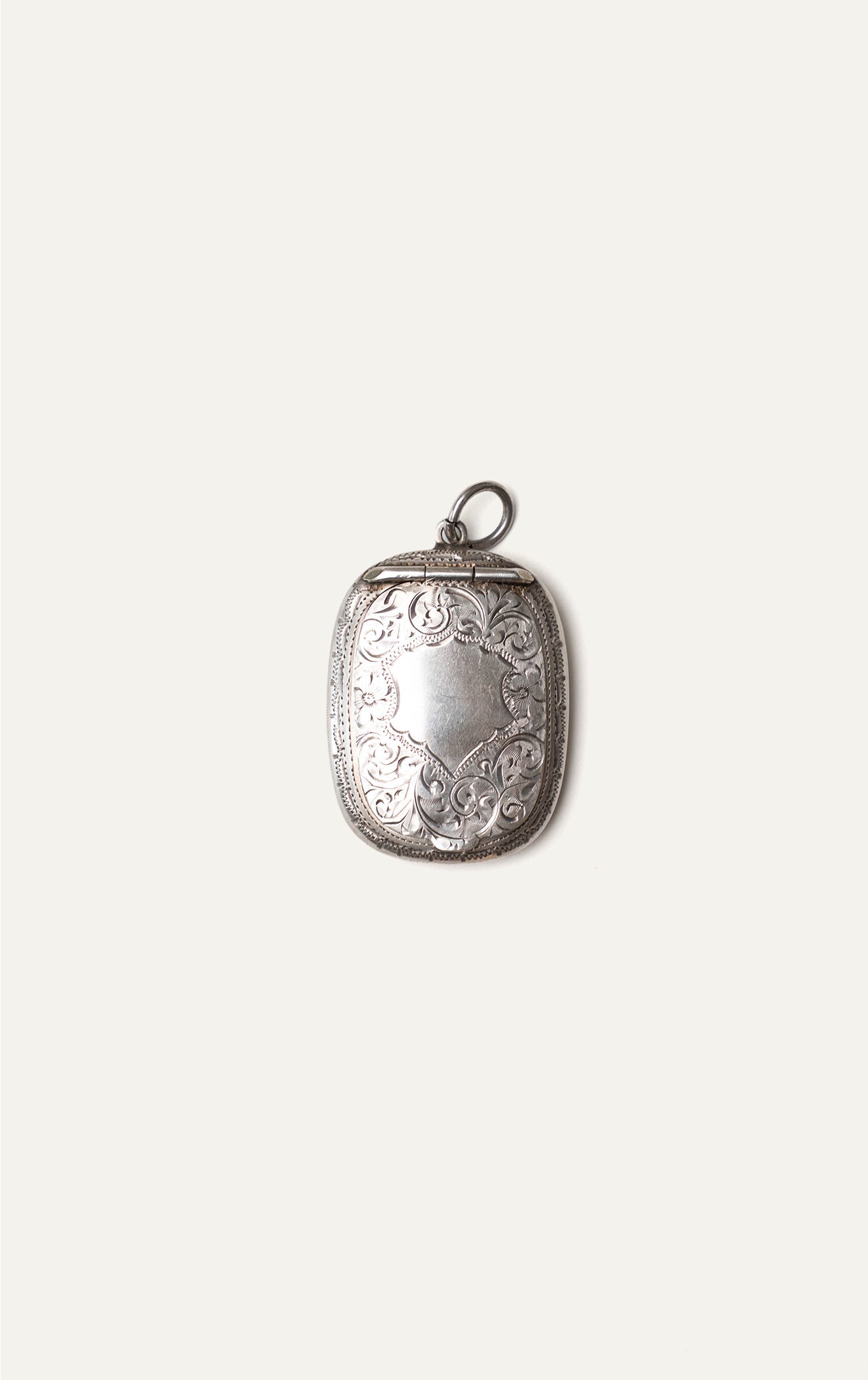 Antique engraved silver pendant case closed