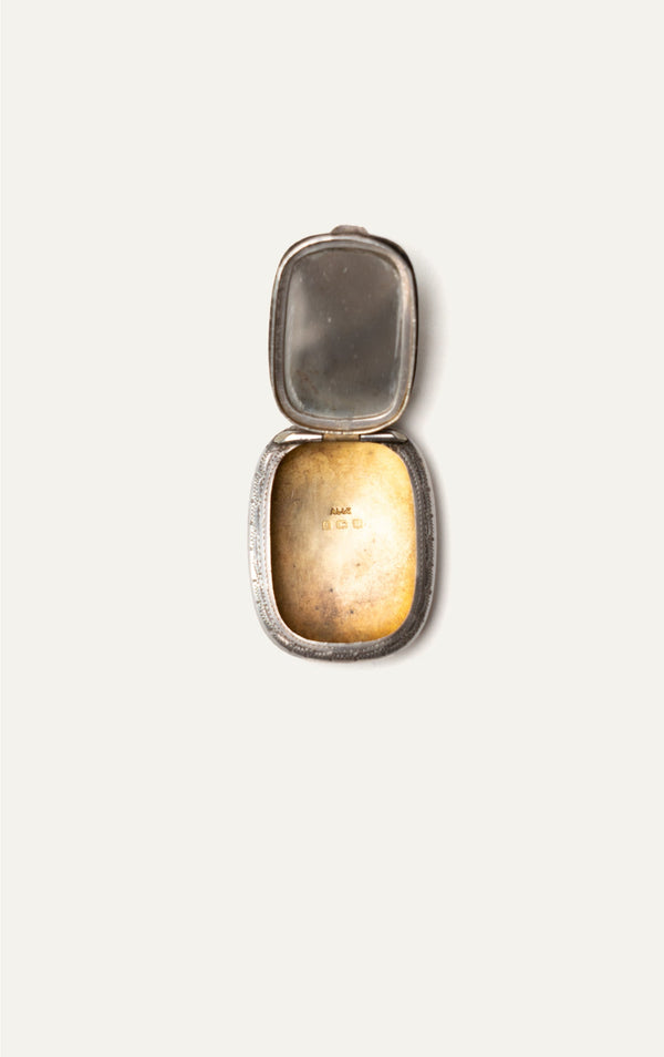 Antique engraved silver pendant case open with hallmarks