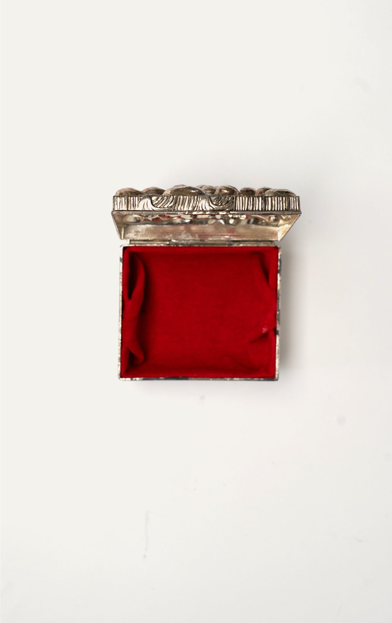 Vintage silver repoussé chrysanthemum box open with red velvet interior