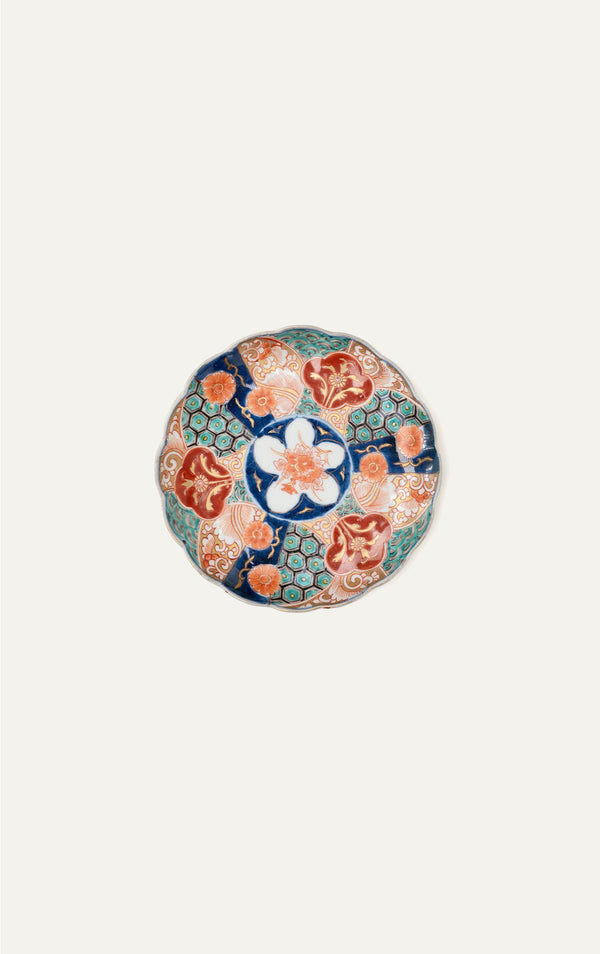 Antique Japanese Imari plate with honeycomb brocade panels top view